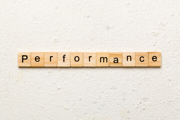 performance word written on wood block. performance text on table, concept