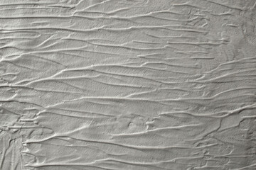 Fluid gray relief background, wavy plaster cement backdrop