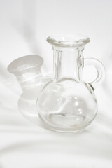 empty round shaped little glass vase on white background