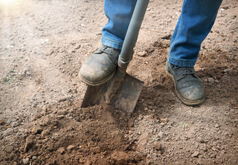 Leg with a shovel. Man digging