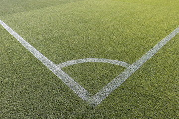 Obraz premium Detail of the corner of a natural grass soccer field. Concept of soccer, competition, football, victory, cup, win and lose.
