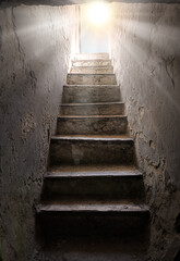 Steps from the dark basement to the light