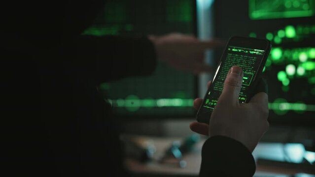 Cyber security hacker with smartphone