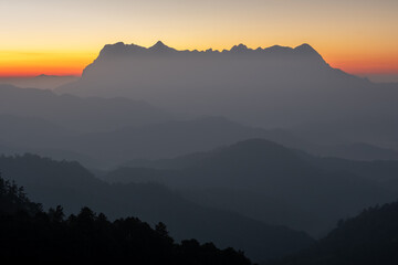 Beautiful Dawn Landscape with Misty Mountains in Thailand