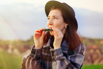 playing the harmonica. a compact musical instrument that is always at hand