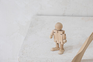 Wooden man figure, doll isolated on the ivory background.