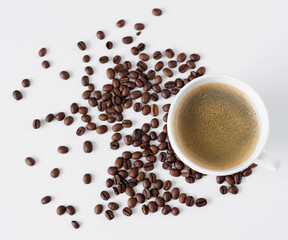Top view of coffee cup and coffee beans on table