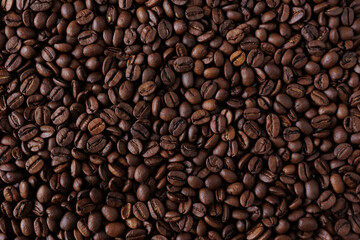 Top view background of aromatic brown coffee beans