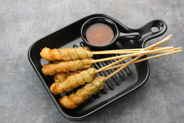 Sempol Ayam, made from minced chicken, spices and eggs. Served with chili sauce. Indonesian traditional food
