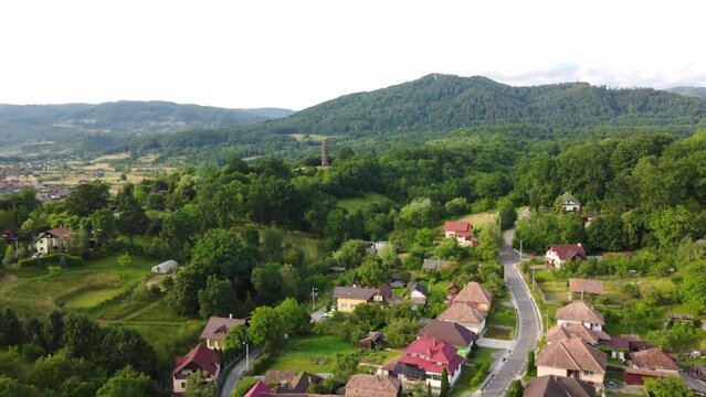 Flying over the city of Sovata - Romania towards the observation tower 