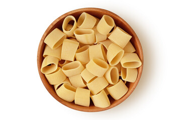 Uncooked pasta calamarata in wooden bowl on white background