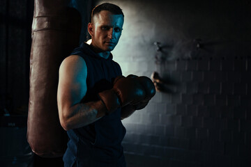 Portrait of male boxer with drops of perspiration on his face.