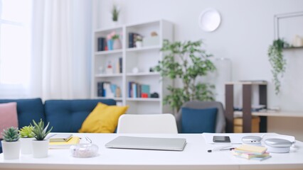 View on empty workplace with laptop on desk, preparation for new workday