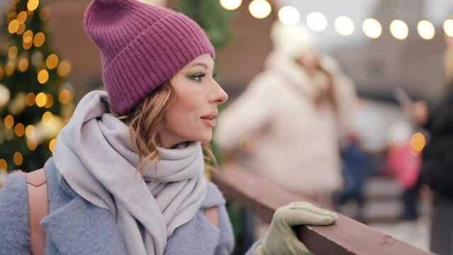 portrait of happy middle-aged woman in city in Christmas vacation, charming lady smiling