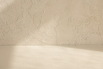 light beige painting background with light and shadow on wall.