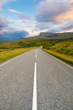 Classic Scottish road during a beautiful summer sunset, Isle of Skye, Inner Hebrides, Scotland
