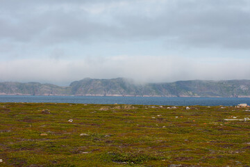 Northern mountains, the sea and mountain cold lakes on the Kola peninsula. Teriberka village
