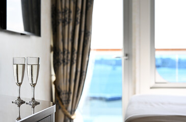 Two glasses of wine in the ship's cabin