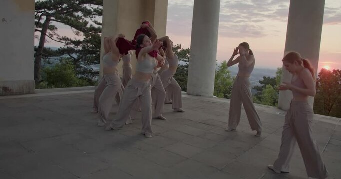 Beautiful interpretive dance outdoors in the early morning, young people, 4k