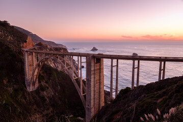 View of Bixby creek bridge and the ocean at dusk in autumn