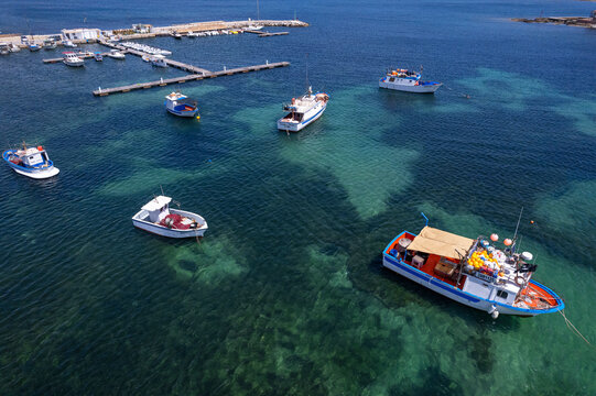 White and blue fishing boats in the water of Marzamemi harbour, Pachino municipality, Siracusa province, Sicily
