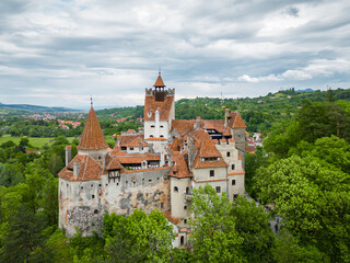 Obraz premium Aerial drone perspective of Bran medieval castle. Located in Romania, it is known abroad as Dracula's castle. Visited annually by many foreign tourists. One of the most visited tourist destinations 