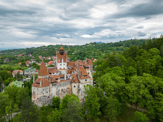 Fototapeta na wymiar Aerial drone perspective of Bran medieval castle. Located in Romania, it is known abroad as Dracula's castle. Visited annually by many foreign tourists. One of the most visited tourist destinations 