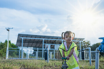 Girl opening water valve from clean energy The concept of opening and closing shut-off valves at a pumping station.