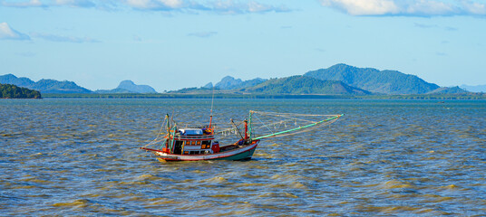 Longtail boat in the Andaman Sea in Lanta Old Town, aka Ban Lanta is a small fishermen village located on the east coast of Koh Lanta Yai island in the Province of Krabi, Thailand