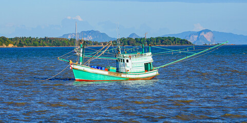 Fototapeta premium Fishing boat in Lanta Old Town, aka Ban Lanta is a small fishermen village located on the east coast of Koh Lanta Yai island in the Province of Krabi, Thailand