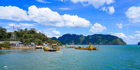Ferry boats moored at Hua Hin pier on Ko Lanta Noi before crossing to the island of Ko Lanta Yai in...
