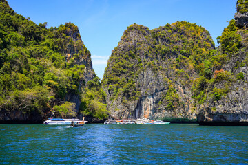 Speedboats waiting at the new back entrance to Maya Bay on Koh Phi Phi Ley island in the Andaman Sea, Krabi Province, Thailand