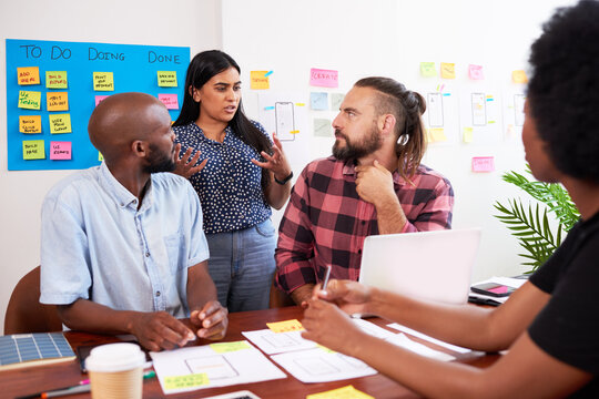 Developers have heated discussion while planning new app, tech start up meeting