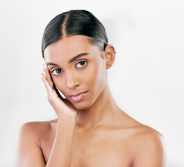 Beauty, skin and face portrait of a woman with natural glow isolated on a white background. Dermatology, makeup and cosmetics of Indian female model for facial shine, wellness or self care in studio