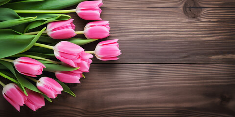 Bouquet of pink tulips on a wooden background with copy space. By Generative AI.