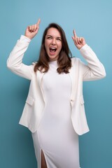 smiling young brunette with long hair lady in white dress has a cool idea and wants to tell about it