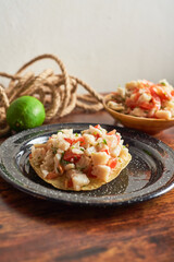 Delicious ceviche of fish with vegetables and tostadas