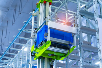 plastic boxes in the cells of the automated warehouse. Metal construction warehouse shelving