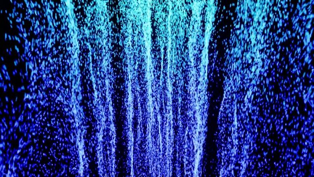 4k wave blurred wall with abstract blue particles flying video effects or fall down in black background. Modern futuristic digital animation for intro or logo backdrop.