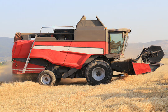 Image of combine harvester harvesting wheat.