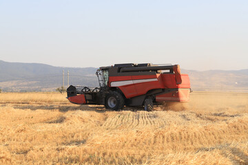 Fototapeta premium Image of combine harvester harvesting wheat.