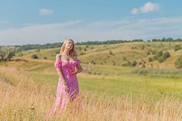 Romantic woman, natural women beauty. Lady at nature, pretty European lady in pink dress