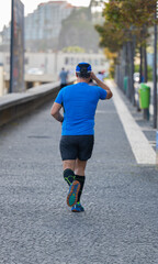 man playing sports on the boardwalk