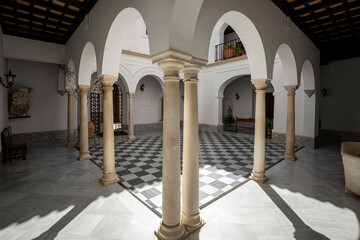White porticoed courtyard with fine columns of the 17th century Mayorazgo Palace in Arcos de la Frontera, Cadiz, Andalusia, Spain © AntonioLopez
