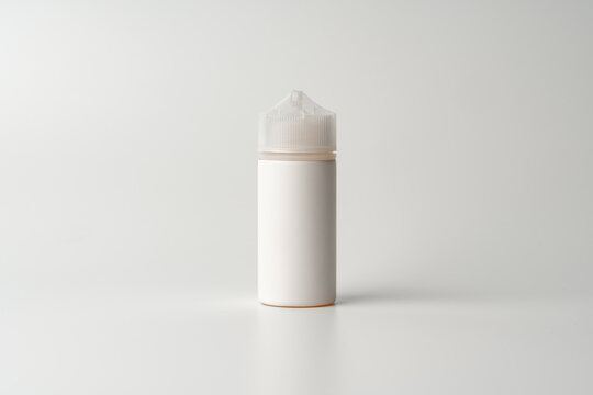 Refill liquid for electronic cigarettes on gray background