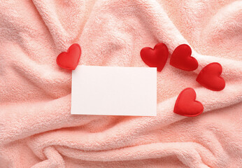 Business card with hearts on pink fabric. Love concept