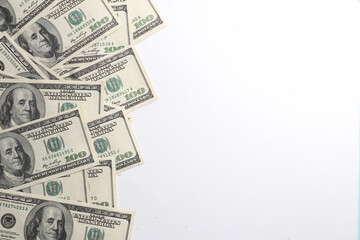 Many hundred dollar bills on a white background. with copy space