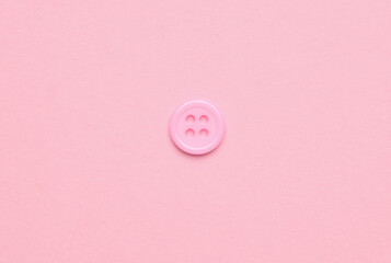 Plastic pink buttons on pink background. Minimalism
