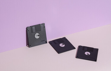 Floppy disks on pastel background. Retro 80s. Outdated technology. Creative layout, minimalism, trendy minimal still life