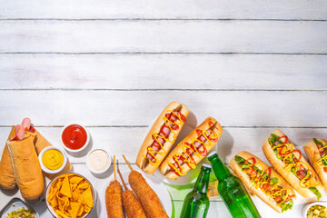 National Hot Dogs day background, hotdog summer party festival foods, Various type of traditional hot dogs - french, corn dog, classic. mexican loaded hotdog, with snack, beer bottles and sauces